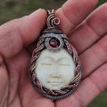 Serenity- bone carving, Hessonite Garnet sterling silver and copper pendant necklace