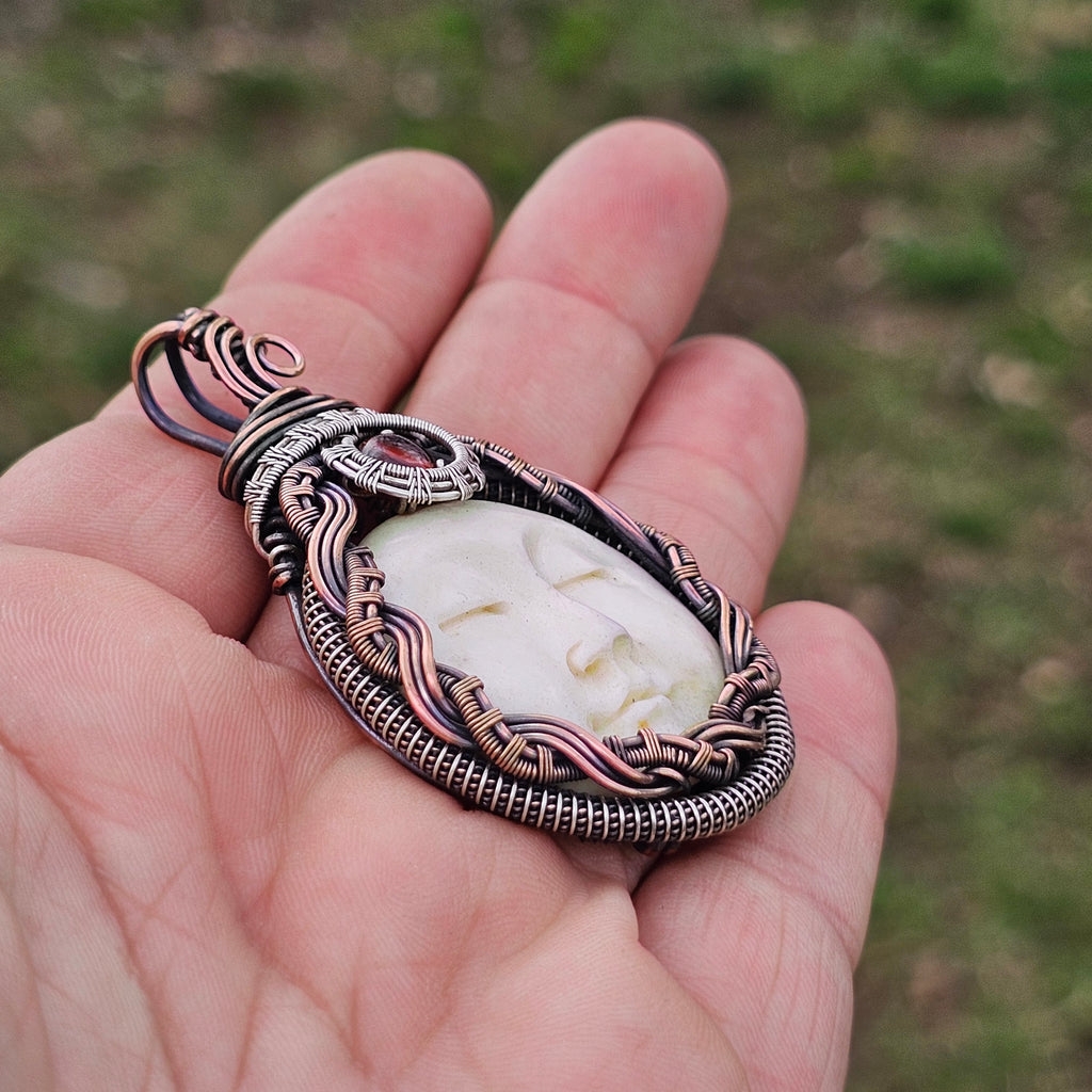 Serenity- bone carving, Hessonite Garnet sterling silver and copper pendant necklace
